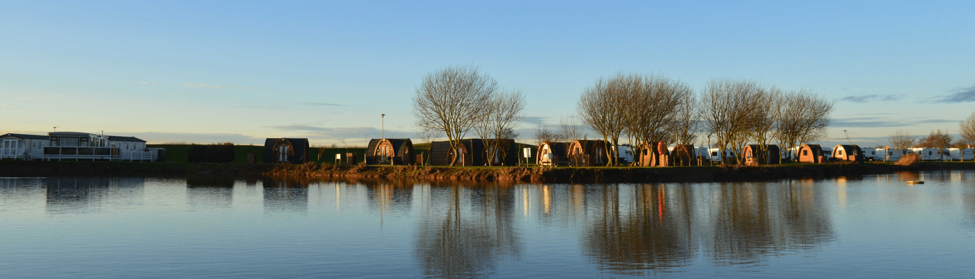 A photo of our lakeside camping pods in the winter months.